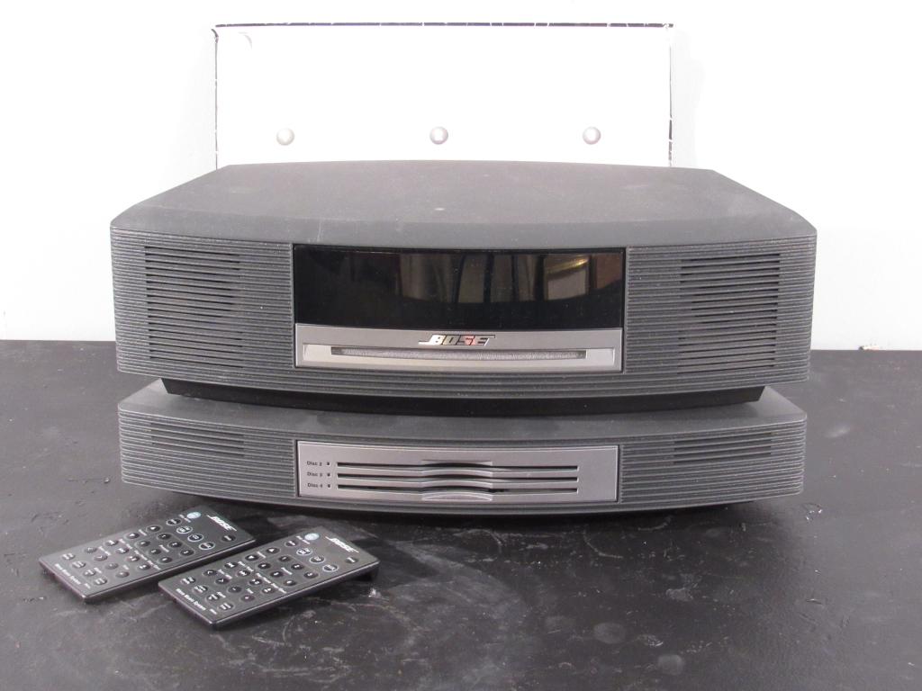 Bose Wave Music System: In 2 parts, 2 remotes with instructions. Takes 4 CDs. Missing main power cord. (East 57 Street Estate)