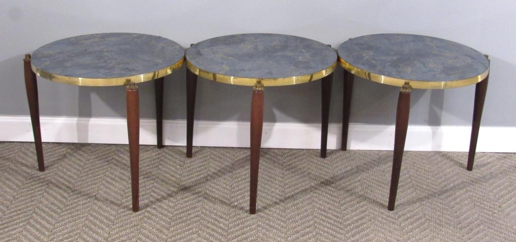 Set 3 Mid Century End Tables: Faux marble tops with brass tone edging on 3 brass tone and wood legs. 17"dia X 15"H