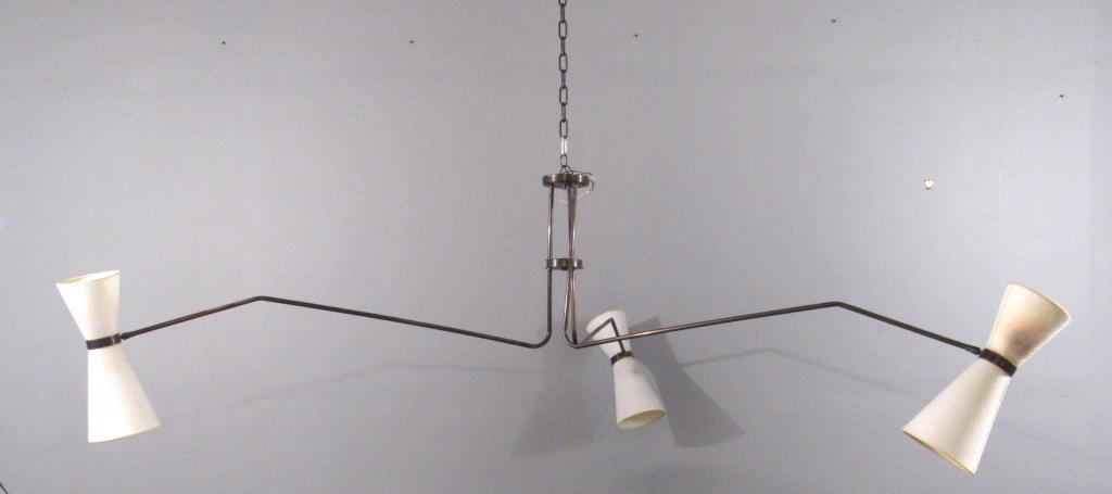Large Holly Hunt Livingroom Fixture: Anodized metal with 3 long arms. Double shades / lights on each end adjustable. 2 shades slightly burned. Center needs tightening which we did not do at time of photo. Arm radius 50"