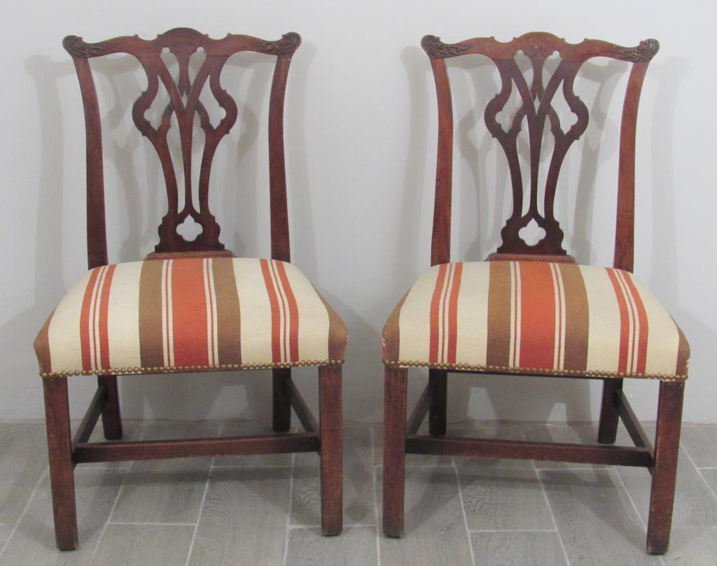 Pair Antique English Side Chairs: Each with open carved back, studded over upholstered seat, "H" stretcher. 22"w X 22"d X 38h. From a Park Avenue Lobby.