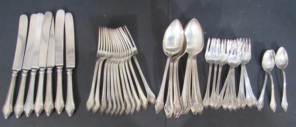 44 Pieces Gorham Sterling Silver Partial Set: 7 Knives, 12 forks, 11 large spoons, 11 salad forks, and 3 odd sized tea spoons. Monogrammed. 46 troy oz without knives.