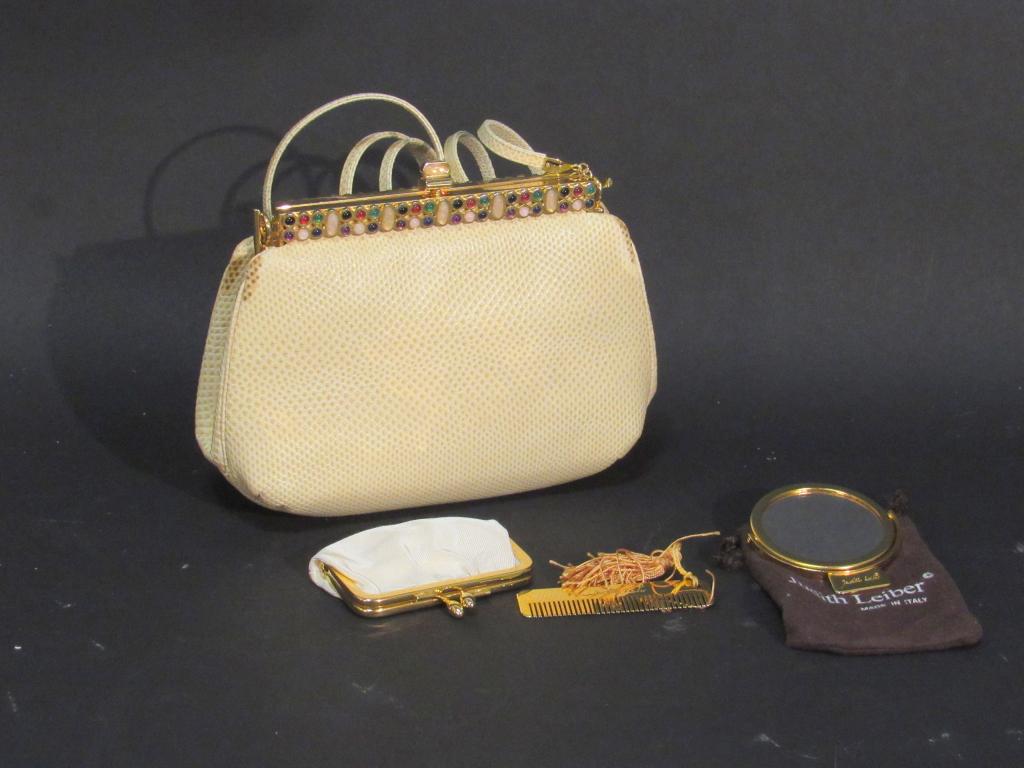 Judith Leiber Collection: Clutch with strap (browned edges), coin purse, comb, and mirror in pouch.
