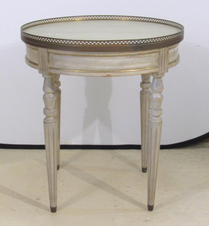 Louis XVI Style Bouillotte Table: Pierced brass gallery on painted and brass trimmed round table, on tapered fluted legs. 26"dia X 29"h.