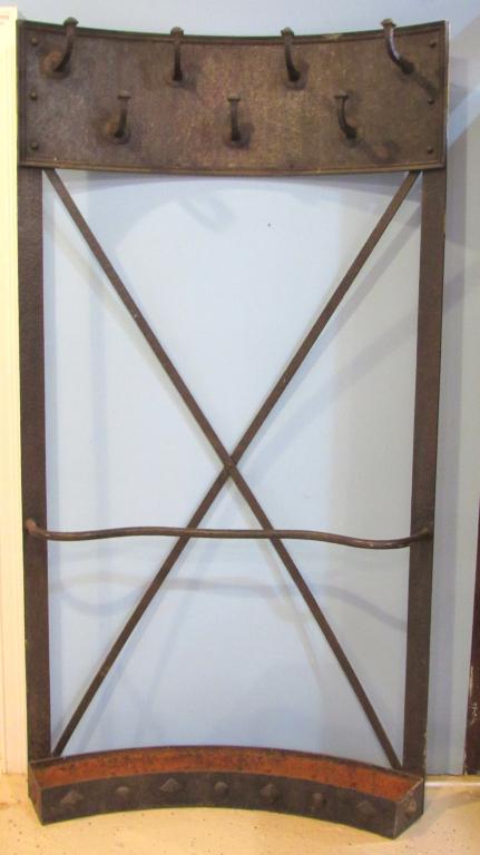 Mid Century / Arts & Crafts Iron Coat Rack: Demi-Lune shape with upper framed panel having 7 hammered coat hooks, X frame with rack and troth style umbrella holder base with ornamental designs. 42"W X 12"D X 79"H.