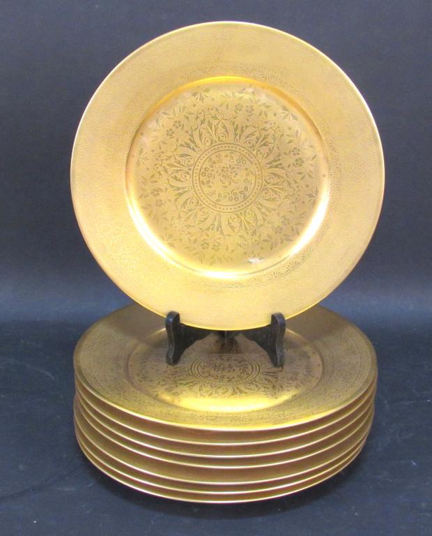 Set of 8 Czech Gilt Place Plates: Gilt covered with an intricate design. Stamped on back. 10.5"dia