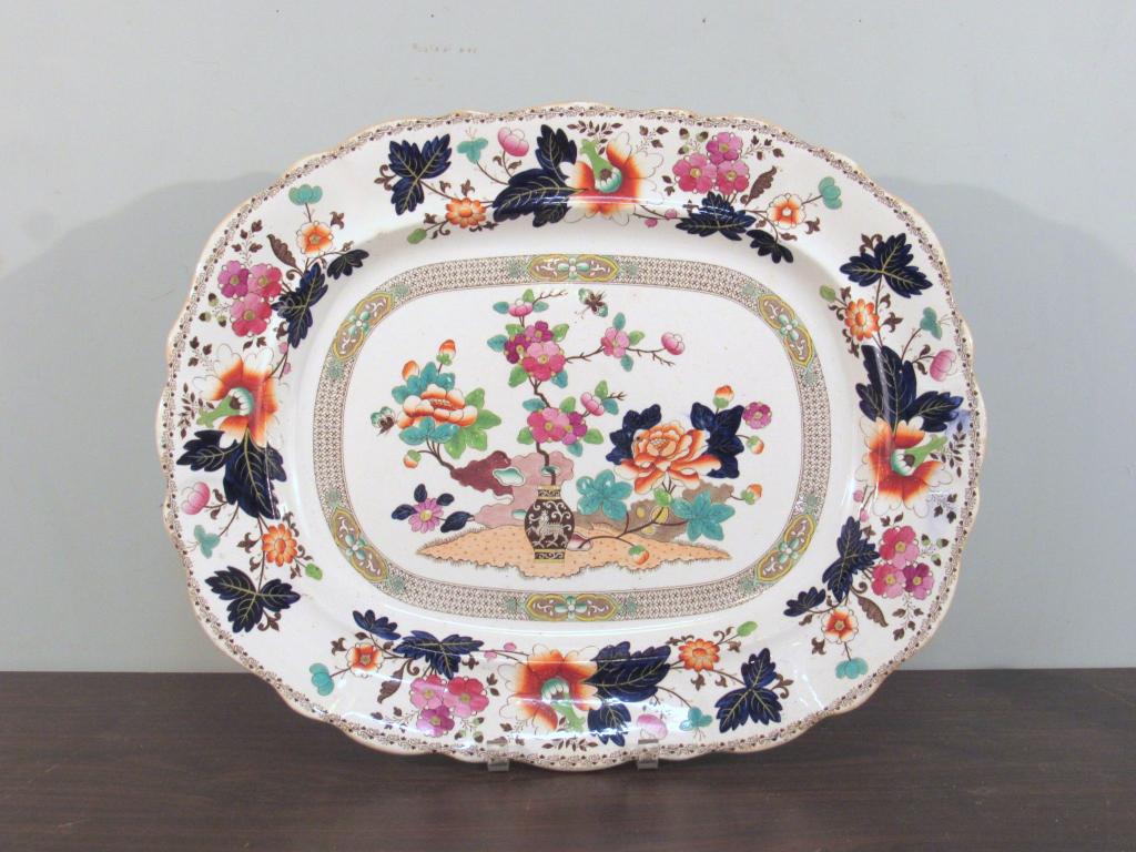 Large Antique English Ironstone Serving Platter: Oval, in an Imari pattern. Browning around edges. Marked on bottom "Bombay Japan" (likely pattern) and hand numbered 798 (?). 21.5" X 17.5" X 2"shallow. (A North Salem, NY Estate)