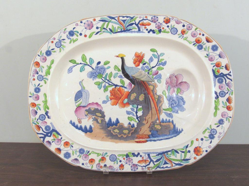 English Ironstone Imari Well-n-Tree Platter: Bird and floral center (scratches) with floral border. Bottom marked "Imp. Iron Stone China Stoke Works". 21" X 16" X 2.5"shallow, footed. (A North Salem, NY Estate)