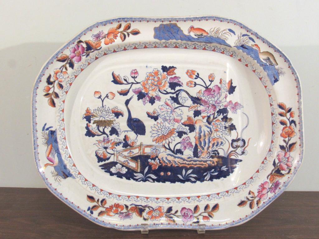 English Imari Ironstone Well-n-Tree Platter: Classical Imari colorful pattern with defined border trim, around shallow platter, octagonal shape. Impressed mark on bottom illegible. 20.5" X 16" X 2.5"shallow. (A North Salem, NY Estate)