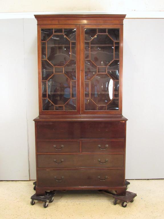 Hepplewhite Style Butler's Secretary: Dentil molding above Mullion glazed doors, secretary drawer with tooled leather interior top, handles present, graduating drawers on bracket feet. 43" X 20" X 85"