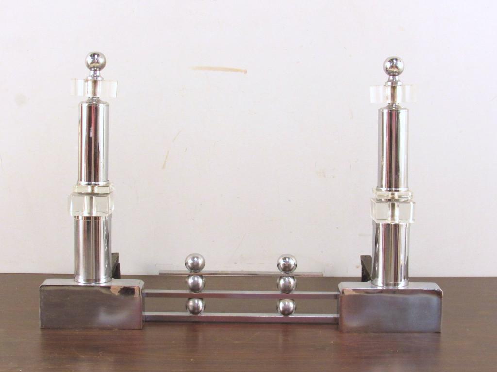 Mid Century Chrome Fireplace Grate: Pair andirons with middle section, all attached. Chrome with glass mounts (a few minor chips). 22" X 12" X 15"h (A Tarrytown NY Estate)