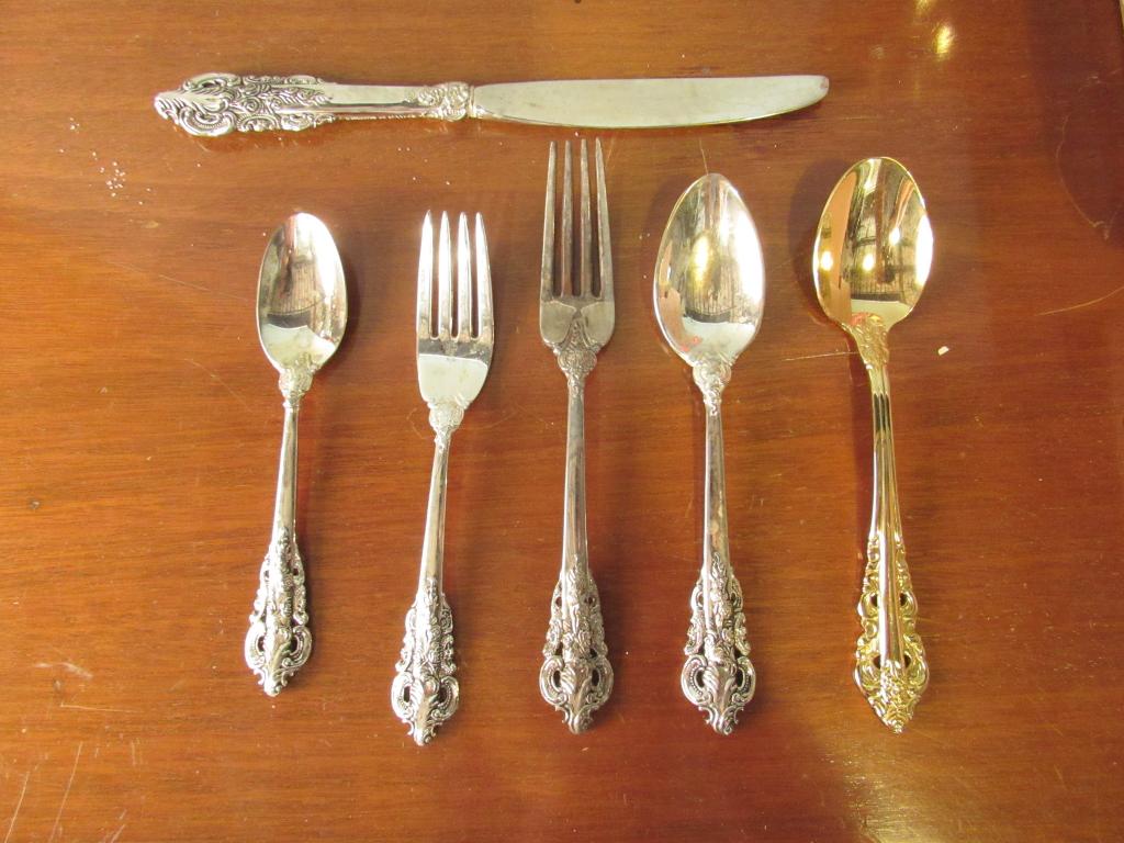 90+ Piece Godinger Baroque Flatware Ensemble: Silver plated and chromed. 12 knives, 20 tea spoons, 20 salad forks, 10 dinner forks, 18 large spoons, 4 gilt spoons, 7 serving pieces. (From a Watertown CT Estate)