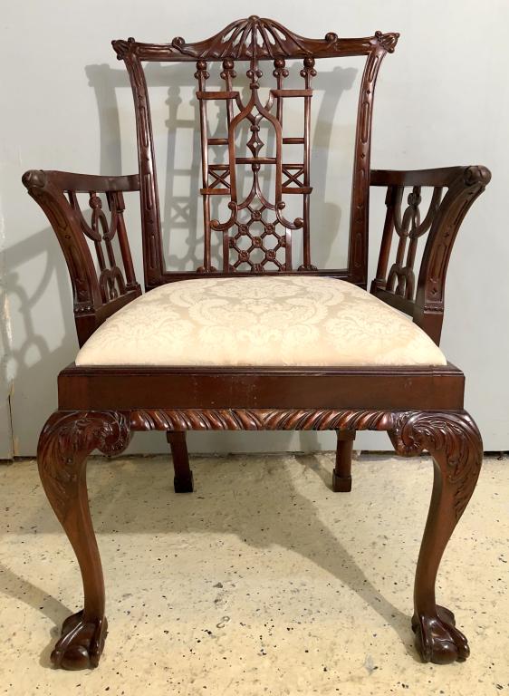 Chinese Chippendale Style Arm Chair: Carved mahogany, open fretwork, ball and claw feet. 25" X 19" X 40" (From a Watertown CT Estate)