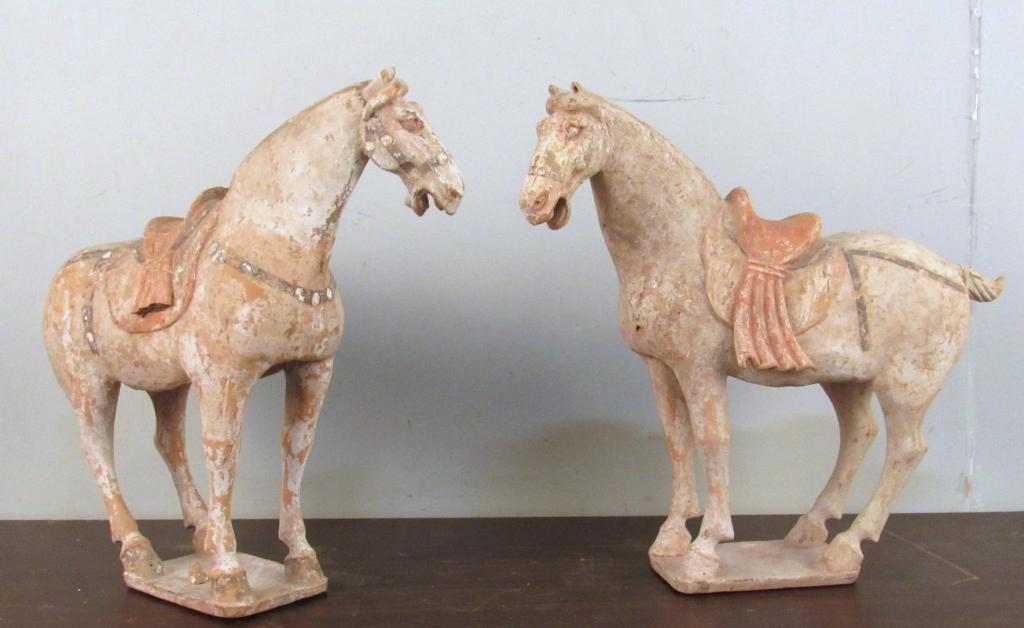 Pair Tang Style Pottery Horses: Roof tile manner, both left facing with matching scalloped saddle drapes (one broken and missing), nice polychrome. One tail broken and repaired. 16" X 6" X 15"h (From a Greenwich CT home)