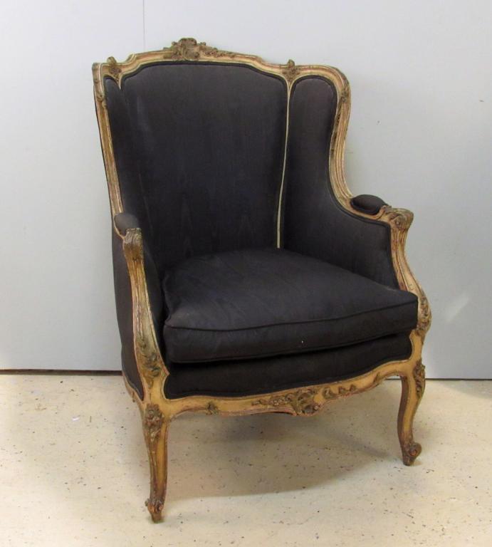 French Carved Bergere: Carved, painted, upholstered, and distressed. Down cushion. 29" x 34" x 41" (From a 1025 Fifth Avenue Estate)
