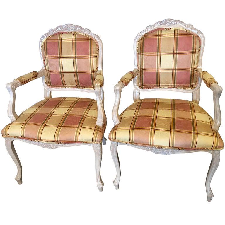 Pair of Burberry Inspired Louis XV Arm Chairs: Set of 2. Custom Upholstered. Carved floral design in a new fabric that resembles the Burberry design. 40" x 25" z 26" Seat height: 19.5"