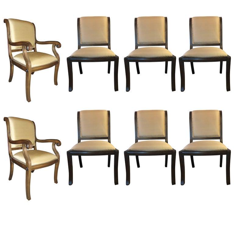 Set of 8 Dining Chairs (101-6413): Sabre leg, sleigh back. Includes 2-arm chairs and a set of 6 chairs. Hollywood regency style and styled in the copy of Maison Jansen. 40" x 24" x 24" Seat height: 19"