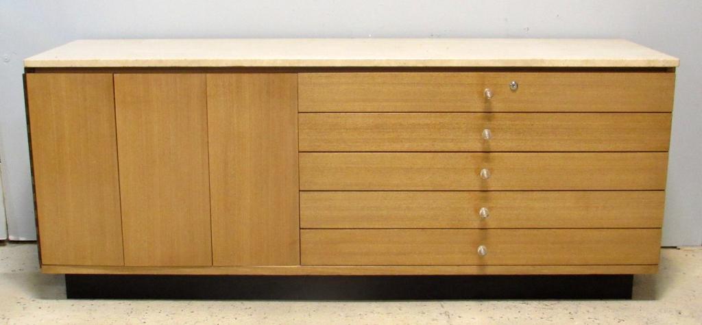 Mid Century Server / Sideboard: Travertine marble top above folding door and 4 drawers with glass pulls. Mounted lock with no key. Recessed base. 71.5" X 20.5" X 29"h (From an 870 UN Plaza, NY Estate)