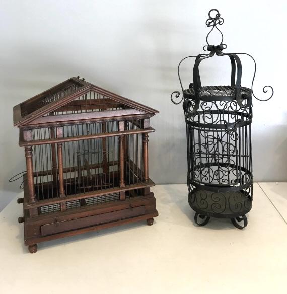 2 Assorted Bird Cages (103): Wooden bird cage measures 17.25" h. Wrought iron candelabra. Wear is consistent with age and use. There is minor fading and scratches.