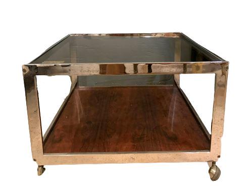 Mid Century Modern Coffee Table Rosewood and Chrome: Glass top. On wheels. Wear is consistent with age and use. Minor scratches. Measures: 25" x 25" x 16"