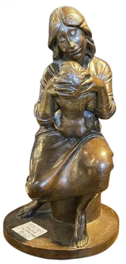 Mother and Child by Bruno Lucchesi: Depicts a Mother holding infant child. Stamped on the bottom. Wear is consistent with age, minor fading. Measures: 10" x 5" dia. (422-82)