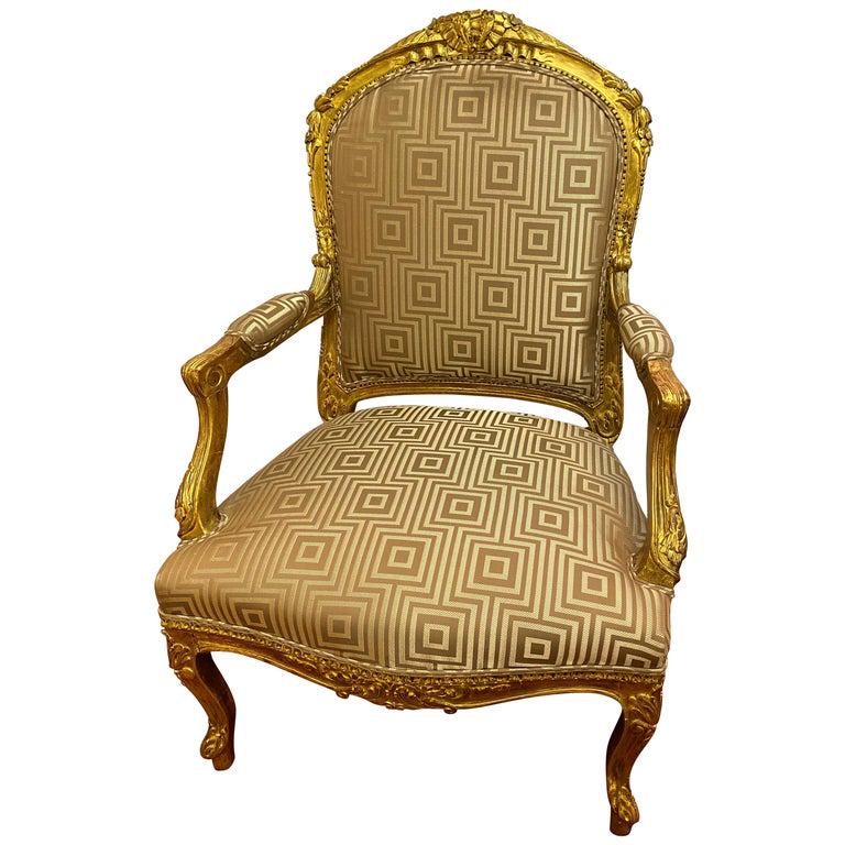 Louis XV Style Gilt Wood Arm Bergere Chair: Louis XV style gilt wood arm Berger chair having a Fendi style fabric in fine condition. This stunning office or desk chair can sit in any room in the home or office as it is certain to draw attention