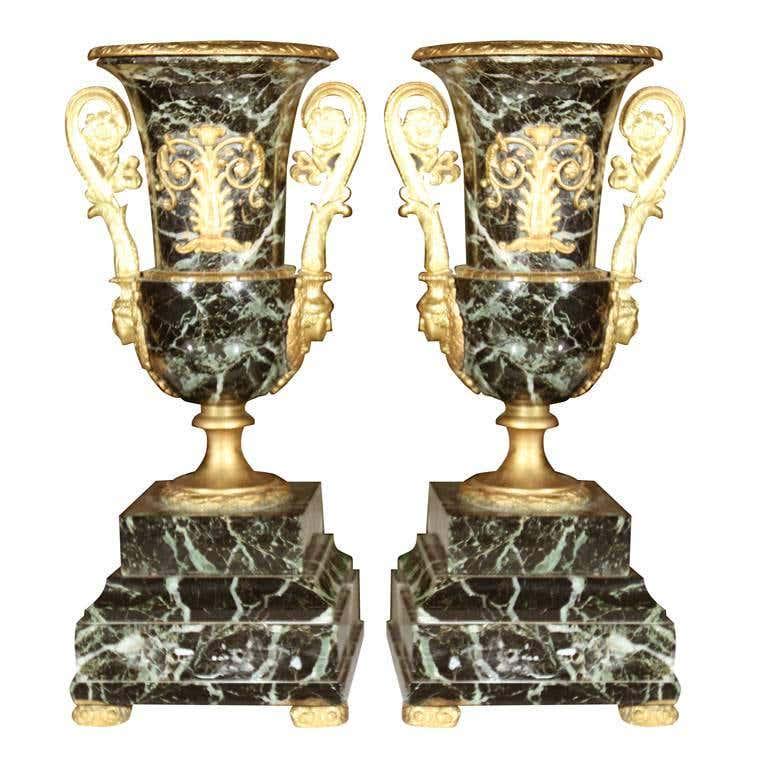 Pair of Neoclassical Bronze and Marble Table Urns: Pair of marble (possibly Malicite) urns, with ormolu decorations and handles, raised on square marble bases standing on ormolu feet. (101-4887) 5.5" w x 4.75" d x 13.25" h