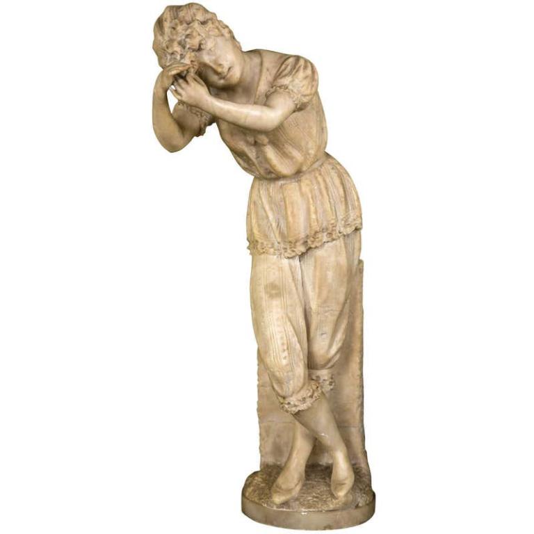 Alabaster Figure of a Standing Woman: A nicely cast alabaster figure of a young woman in her pajamas washing out her hair. In 19th century attire this figure is leaning upon a slab of stone rinsing her hair out. (101-5192) 22.5" x 6" dia