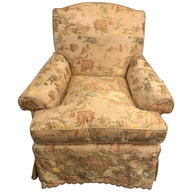 Magnificently Upholstered Overstuffed Armchair: A magnificently upholstered overstuffed armchair on casters by O Henry House in the finest silk upholstery that is fully lined and pleated sitting on English style legs with casters. (429-63) 33" x 30