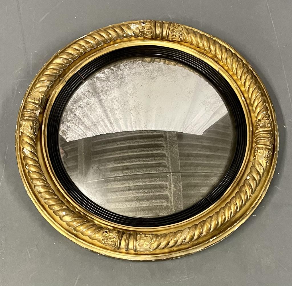 19th Century Federal Convex Mirror 455-41: Having a gilt and ebony border. 26" dia x 3" h This item removed and sold without reserve from the Long Island home of Dr Shawn Garber.