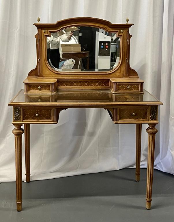 Louis XVI Style Vanity Desk 455-98: Dressing table with attached mirror. Good Condition. Mathcing bed and nightstands sold in this sale auction. 51" h x 39" w x 22"d This item removed and sold without reserve from the Long Island home o