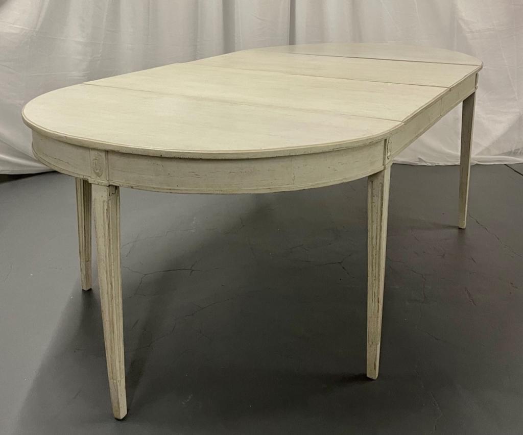 Swedish Gustavian Dining Table 19th Century.: Having 2 leaves each and support board. A pair of finely painted demi lunes that convert into an impressive dining table. Leaves measure 23.5 in. Total Table 94" w x 47"d x 30hProperty of a CT Lady.