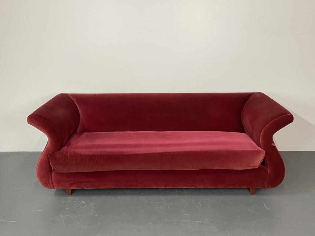 Chanel Form Style Red Velour Sofa: A Red Velour Sofa having Chanel Style Form possibly a house of ill repute. Upholstery in good condition H 30 W83 D32 SH 18
