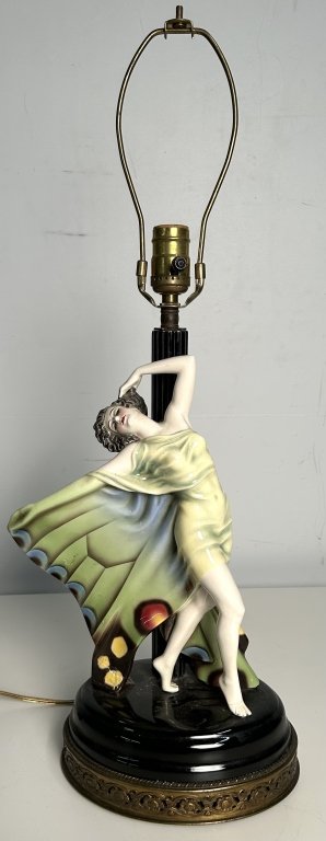 Gold Schneider Style Can-Can Woman Table Lamp: Gold Schneider Style Can-Can Woman Table Lamp. Porcelain with ornate brass detailing on base. Height to Socket 19 Inches, Width 9 Inches, Depth 6 Inches. Crack on back of post.