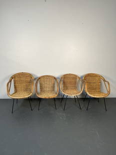 Set of Four Arthur Umanoff Wicker Bucket Chairs: Set of Four Compatible Arthur Umanoff Rattan Bucket Chairs. American Mid-Century furniture designer, Arthur Umanoff is identified by his use of wicker and wrought iron construction. Some damage