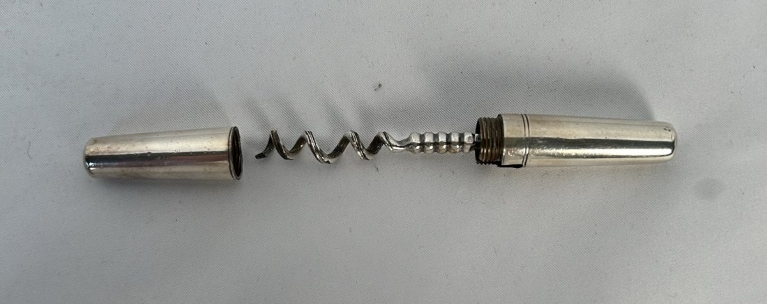 Vintage Pocket Sized Silver Plated Corkscrew: Vintage Pocket-Sized Silver-Plated Corkscrew. Measures: 3 Inches.This item twists, turns and works.