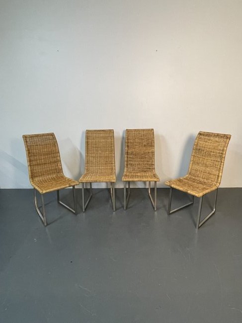 Set of Four Wicker Chairs with Chrome Base: Set of Four Wicker Chairs with Chrome Base. Height 38 Inches, Width 17.5 Inches, Depth 21 Inches, Seat Height 18 Inches.