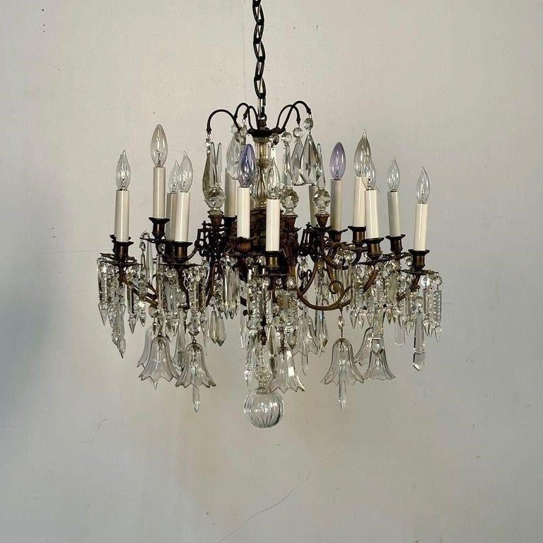 Bronze and Crystal Victorian Chandelier, 19th C.: 19th Century Victorian Chandelier, Bronze and Crystal,A solid bronze and crystal Victorian era chandelier having a center circular bronze sphere supporting bronze arms and fine antique crystal adornme