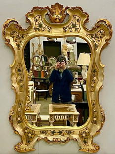 Gold Leaf Shell Form Wall Mirror: A gold leaf paint decorated shell form mirror depicting a floral scene.DimensionsHeight: 52 inWidth: 39 inDepth: 2 inSKU: 101-5839