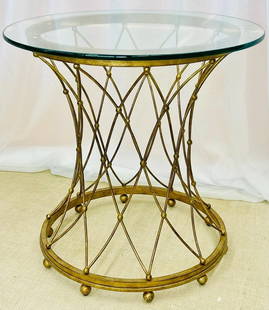 Neoclassical Round Gilt Metal Table, Jansen Style: Neoclassical, Maison Jansen Style Round Gilt Metal Coffee Table, Side TableDecorative coffee or side table have an eccentric basket type metal base.DimensionsHeight: 25.60 inWidth: 26 inDepth: 26