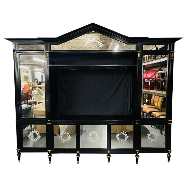 Hollywood Regency Bunny Williams Ebony, Mirrored, Bookcase, Entertainment Unit: Hollywood Regency style ebony, mirrored cabinet, bookcase, Entertainment Unit, Breakfront, Bunny WilliamsEbonized and mirrored.Pillows are not included.Measures: 8'4" H x 115" W x 25" D101-91021ZSX.