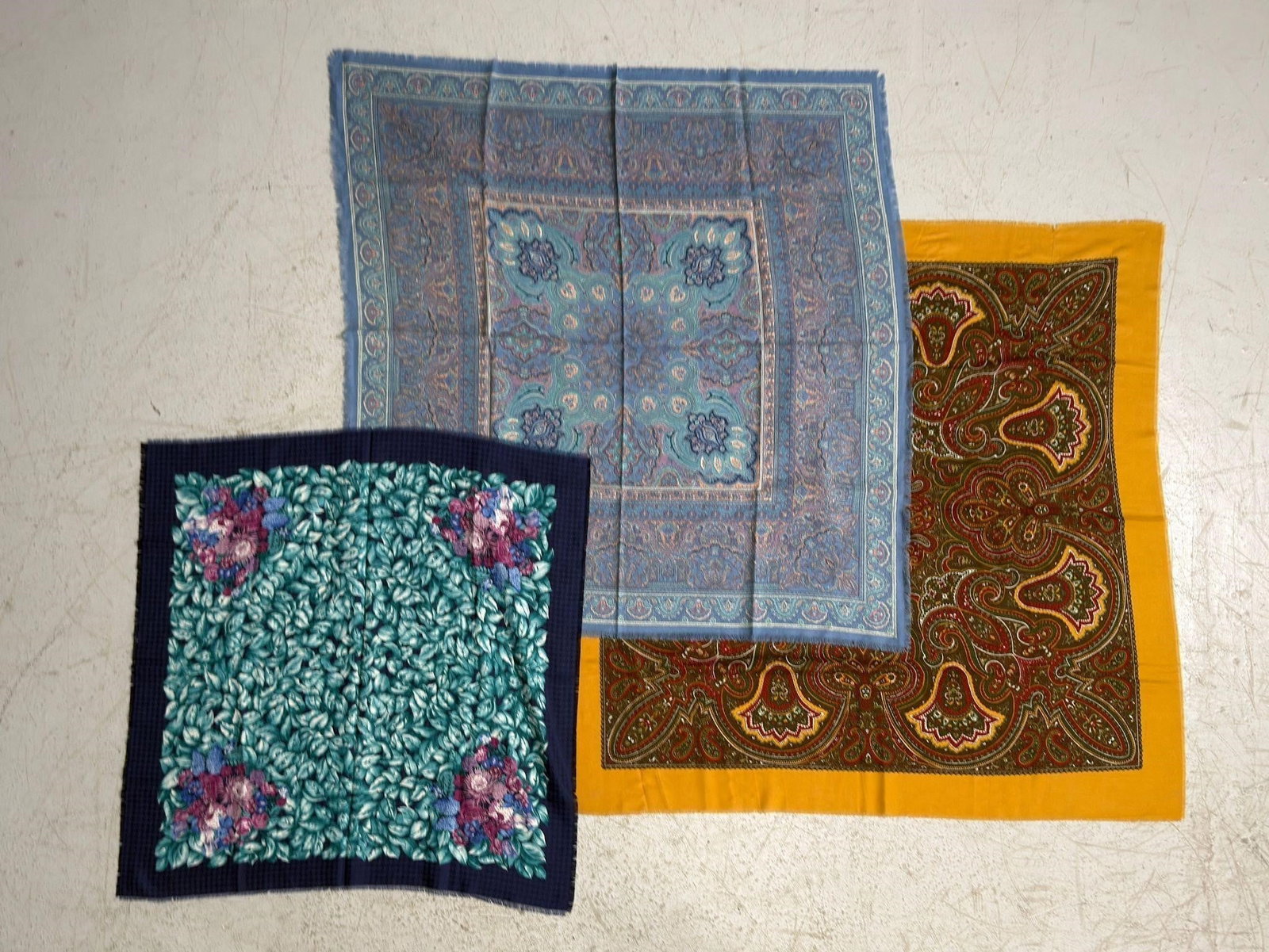 Three Wool Scarves, Made In France.: Three square scarves featuring floral and paisley designs.Largest 45 x 45 inches. Woolmark 100 % Wool. Made in France.
