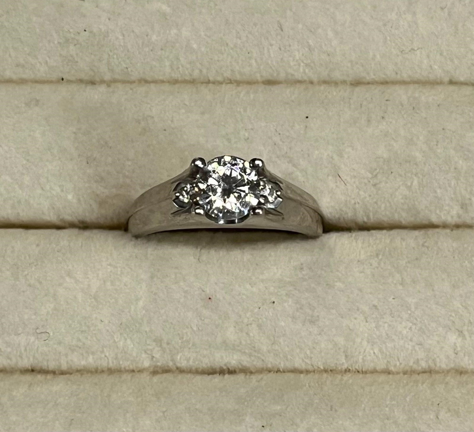 An Art Deco Engagement Ring with a Center Diamond: An Art Deco engagement ring with a center diamond measuring .75KT in a sterling silver setting