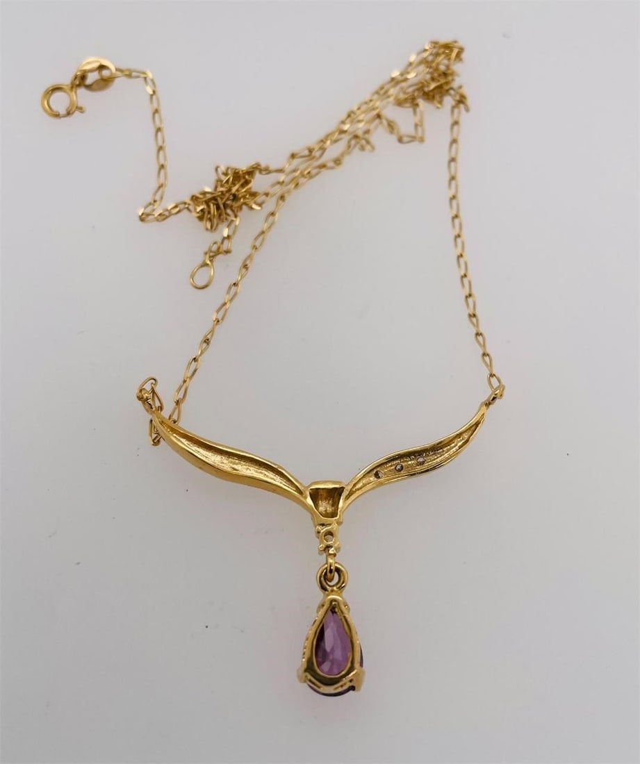 18k Pendant Necklace, Amethyst, 5.29g: Gold necklace with amethyst , stamped 750. 18" chain, slightly tangled. 5.29g Box 37
