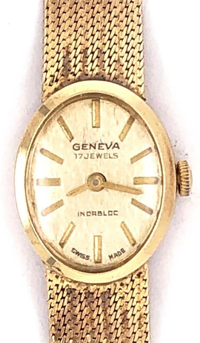 14k Gold Geneva Swiss Made Vintage Watch 18.1Grams: Vintage 14 Karat Yellow Gold Geneva Swiss Made Watch7inch Vintage 14Kt Yellow Gold Geneva Swiss Made Watch weighting an astounding 18.1 grams having a lovely mesh band all gold. Weight is without the 