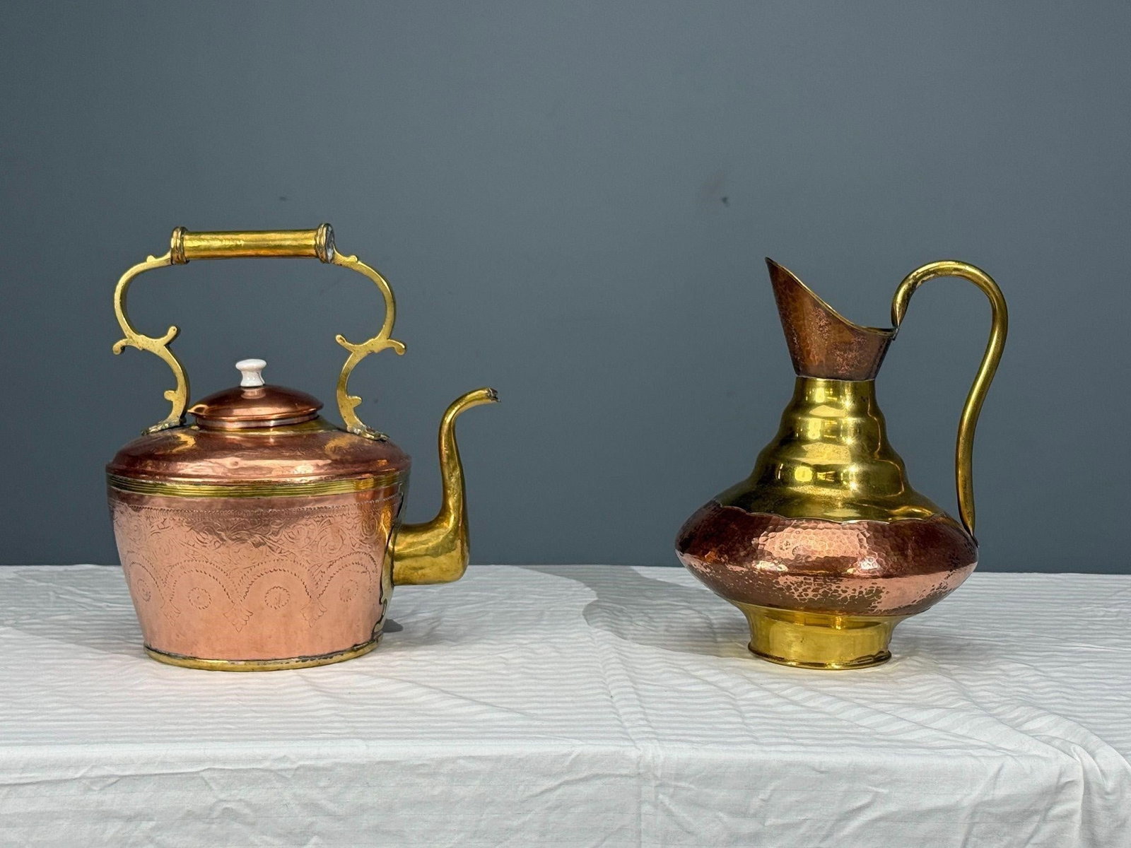 Dinaderie Vintage Copper Teapot and Water Jug: Made in Belgium Stamped along with 211 Dinaderie BifttlotTeapot: H14.5, W10, D13 inches.Water jug: H13.5, W10.25, D10.25 inches.
