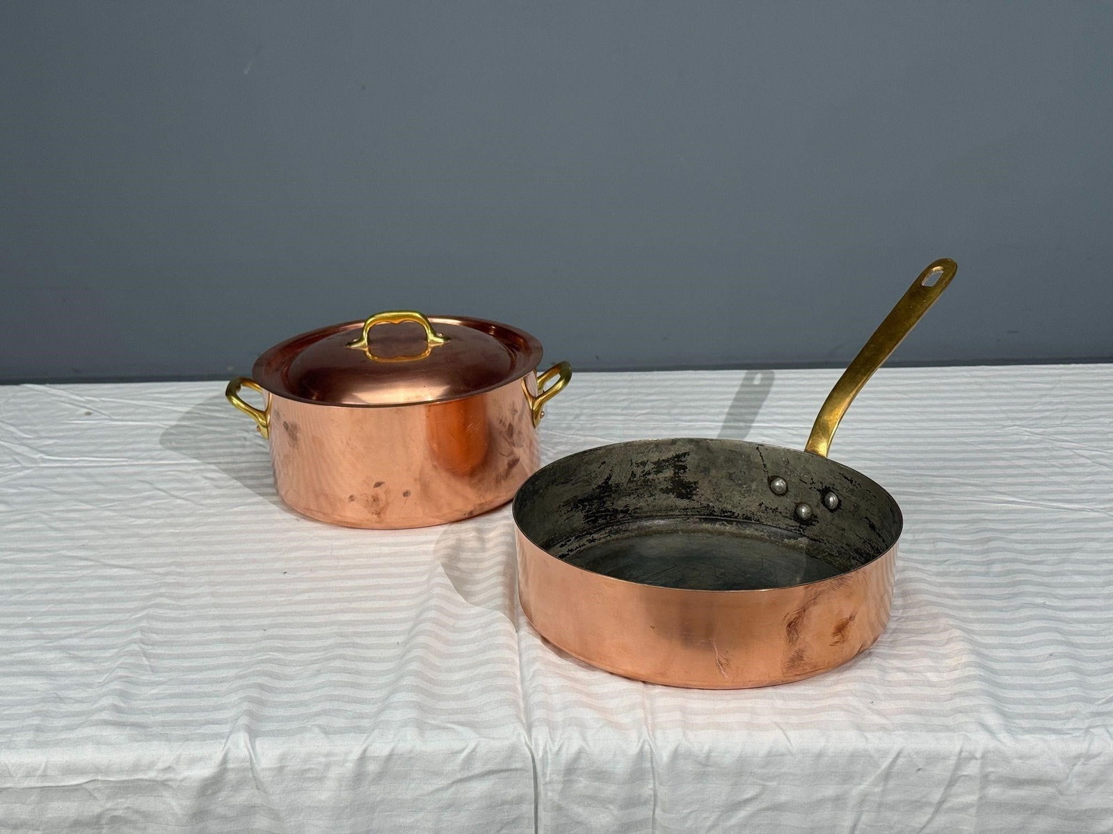 Made in France Copper Pot and Pan Brass Handles: Stamped MADE IN FRANCE. Pot: H7, W12.25, D10.5 inches.Pan: H7.75, W11.25, D20 inches. Made In France.