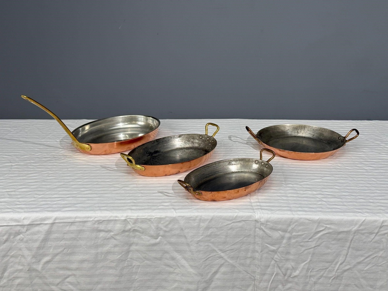 4 Tagus Chef Vintage Copper Pans, Brass Handles: The set in good original condition. Some marked Made in FranceLarge : H8.75, W9, D17.5 inches;Small : H2.25, W7, D12.5 inches