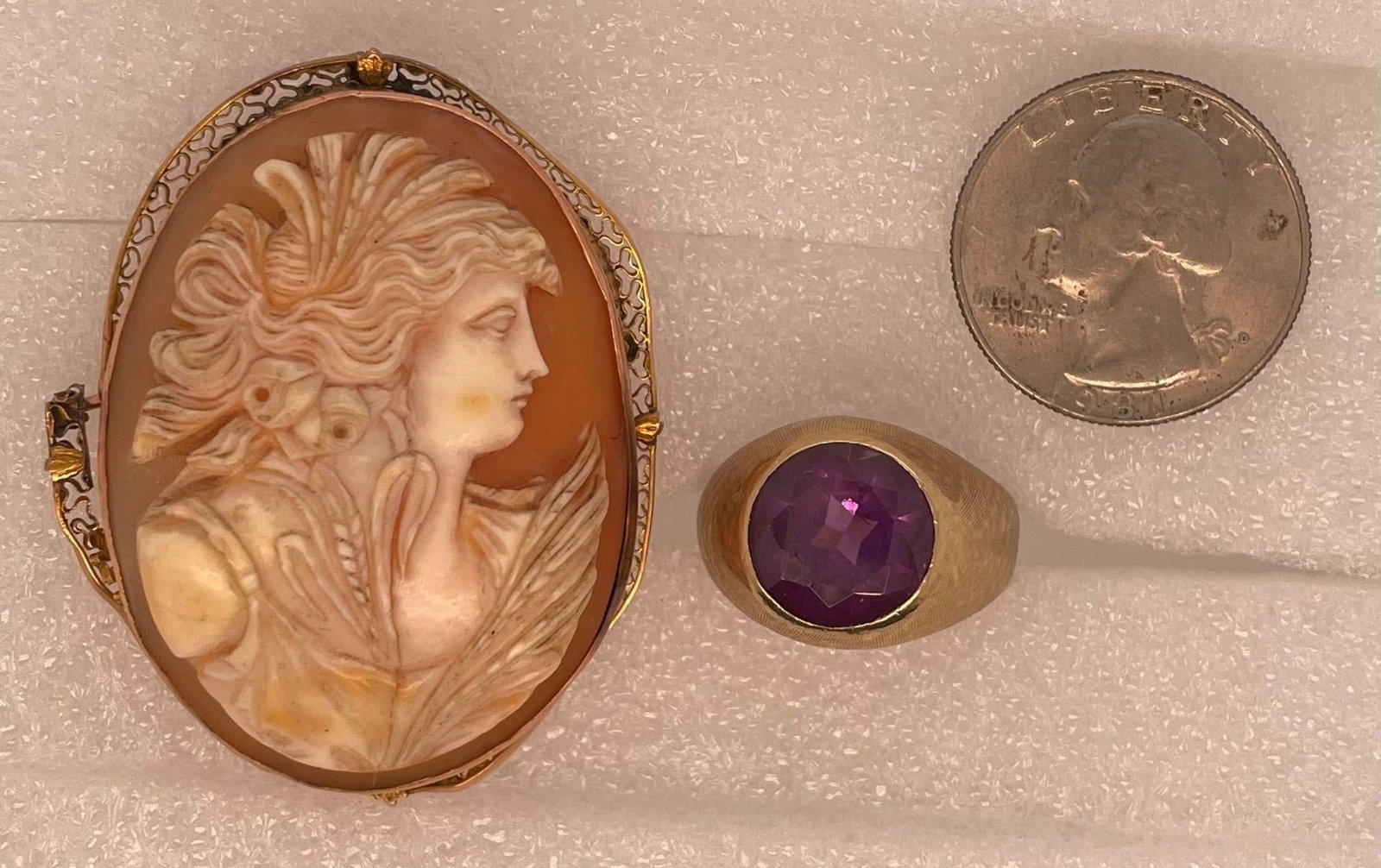 14k Gold Amethyst Ring and 14K Cameo Pin,: An amethyst ring and a cameo brooch. 14k.Ring size: 8.5.