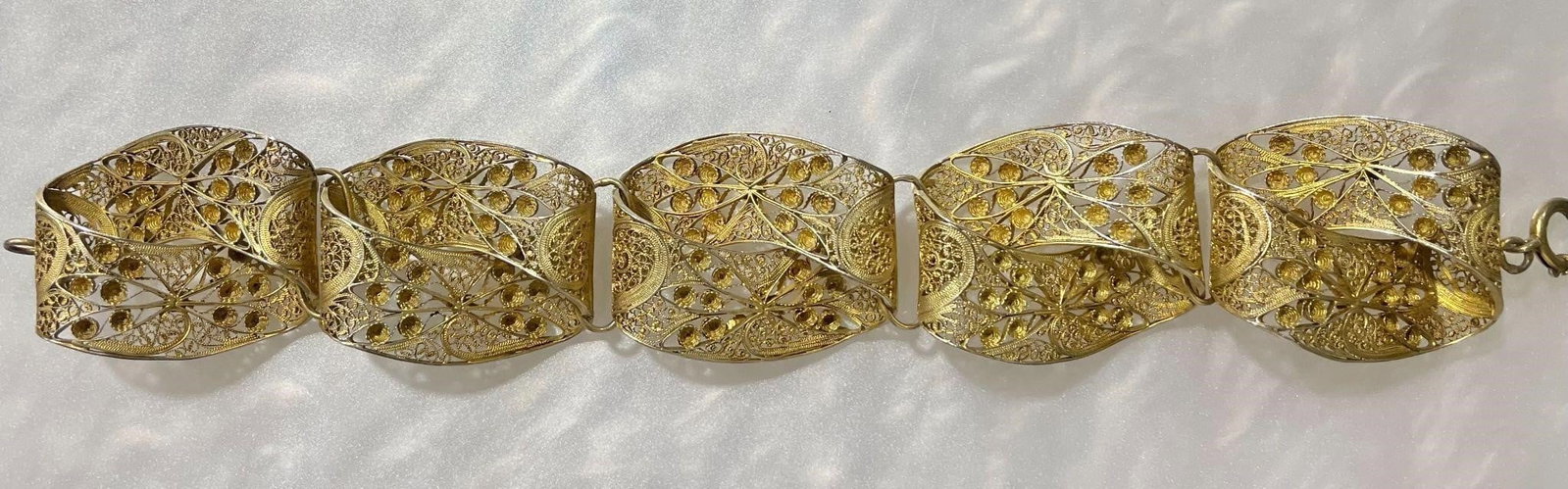 10K Yellow Gold Bracelet, 36.98 grams: A vintage ornate 10Kt Gold filigree with detailed floral and scrollwork design bracelet. 8 inches long