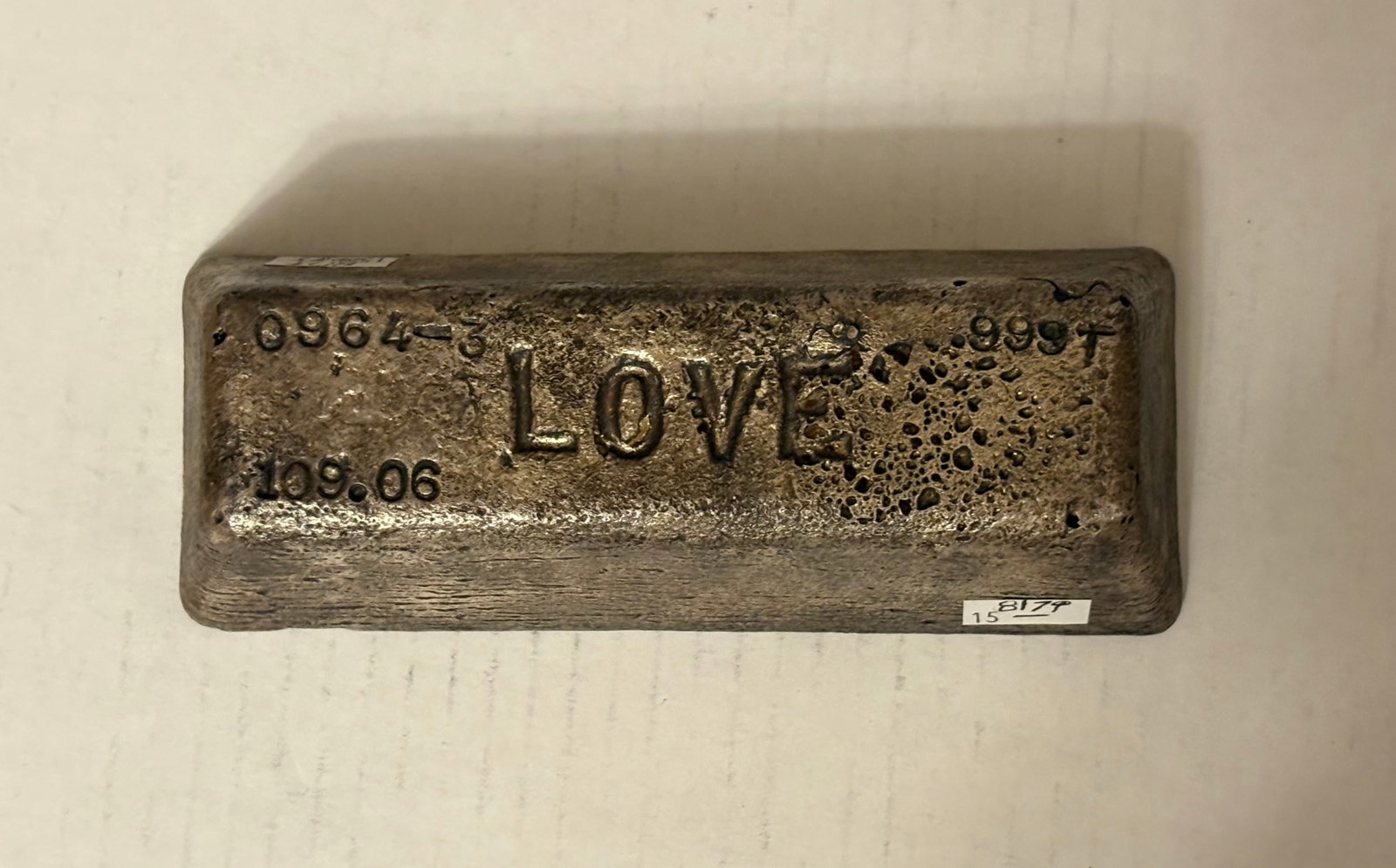 A Brick of Silver, Stamped and Marked: A Brick of Silver, Stamped and Marked. A silver bar that is stamped and marked. Please examine prior to bidding. As is Condition. Minor scratches, some dirt, worn.